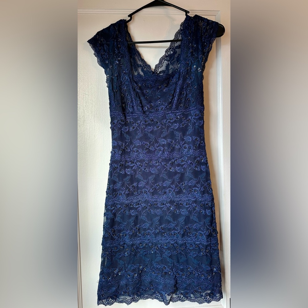 Form fitting blue beaded dress. Size 6